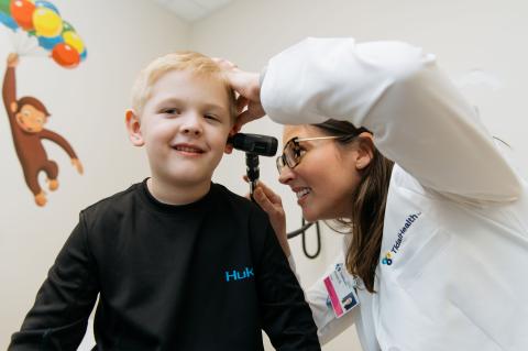 Kristen Bowie, NP, examining a pediatric patient